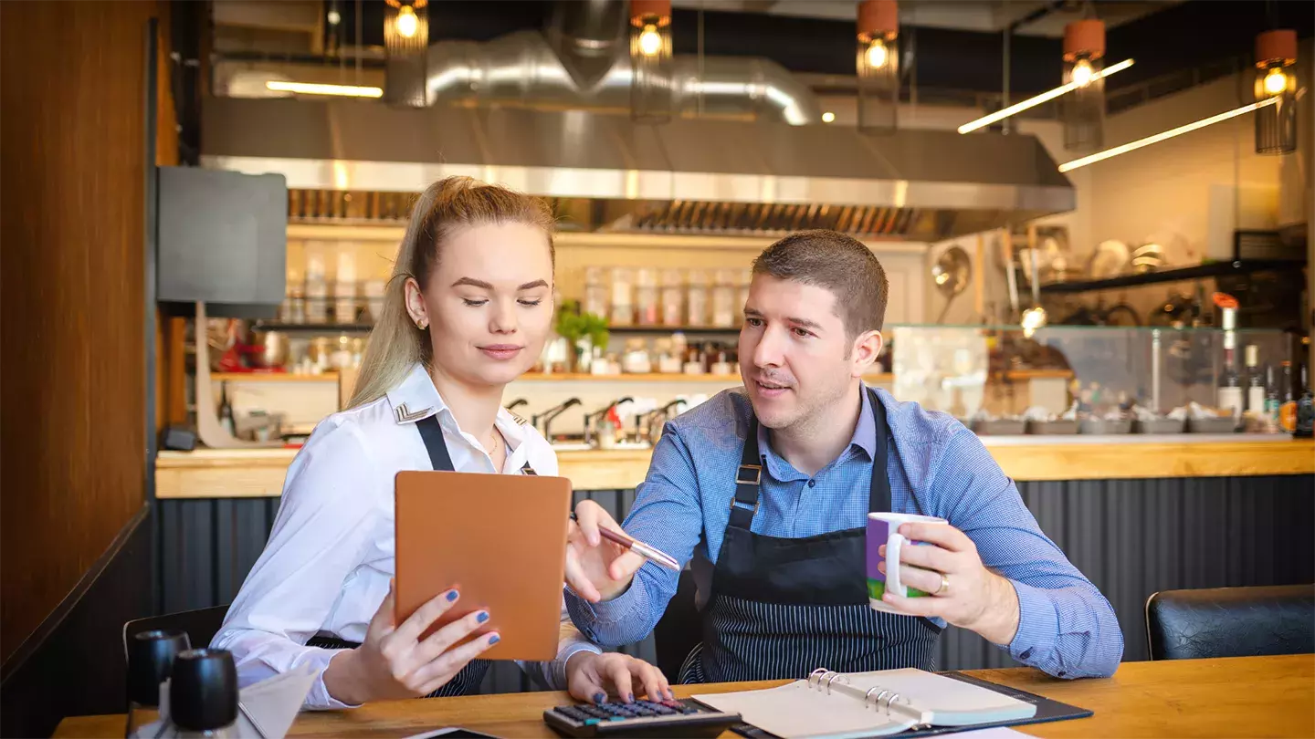 Restaurant workers doing paperwork